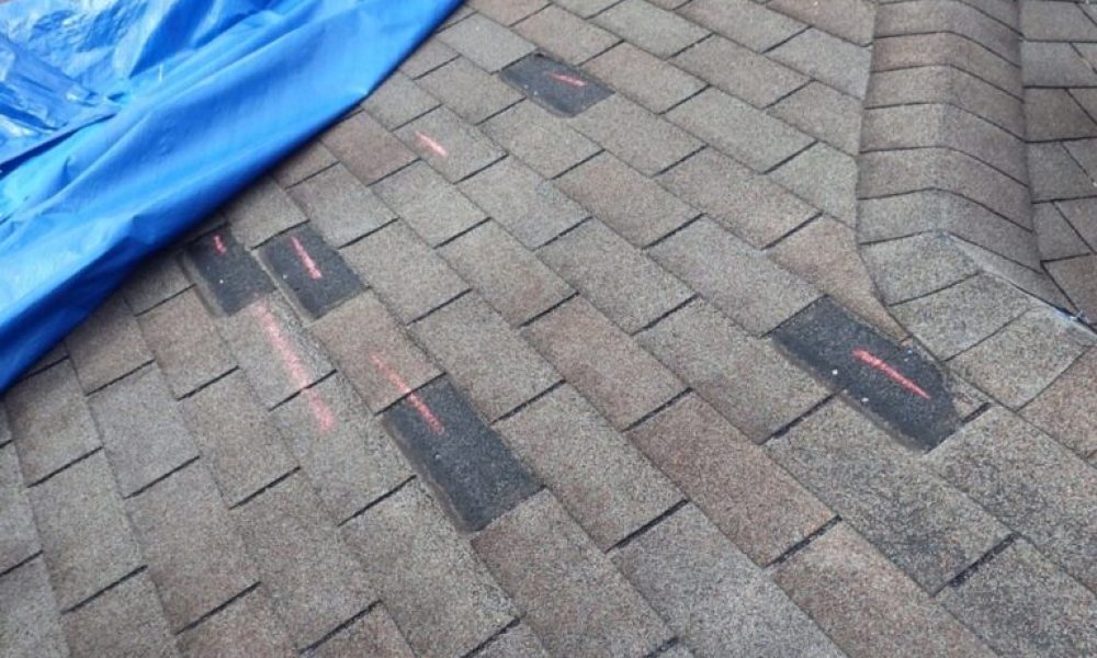 Wind-damaged-roof-768x573